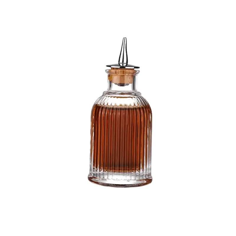 Circular Vintage-Style Bitters Bottle With Etched Detailing 1
